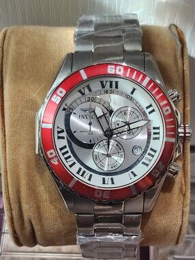 Invicta Silver Watch with Red Bezel and White Dial